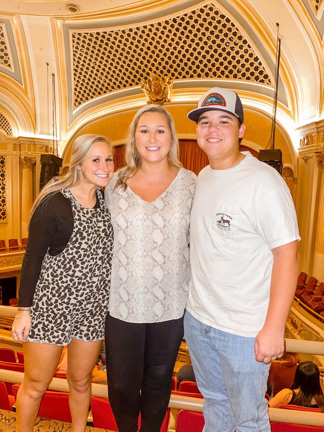 Will with friends in an ornate indoor theater