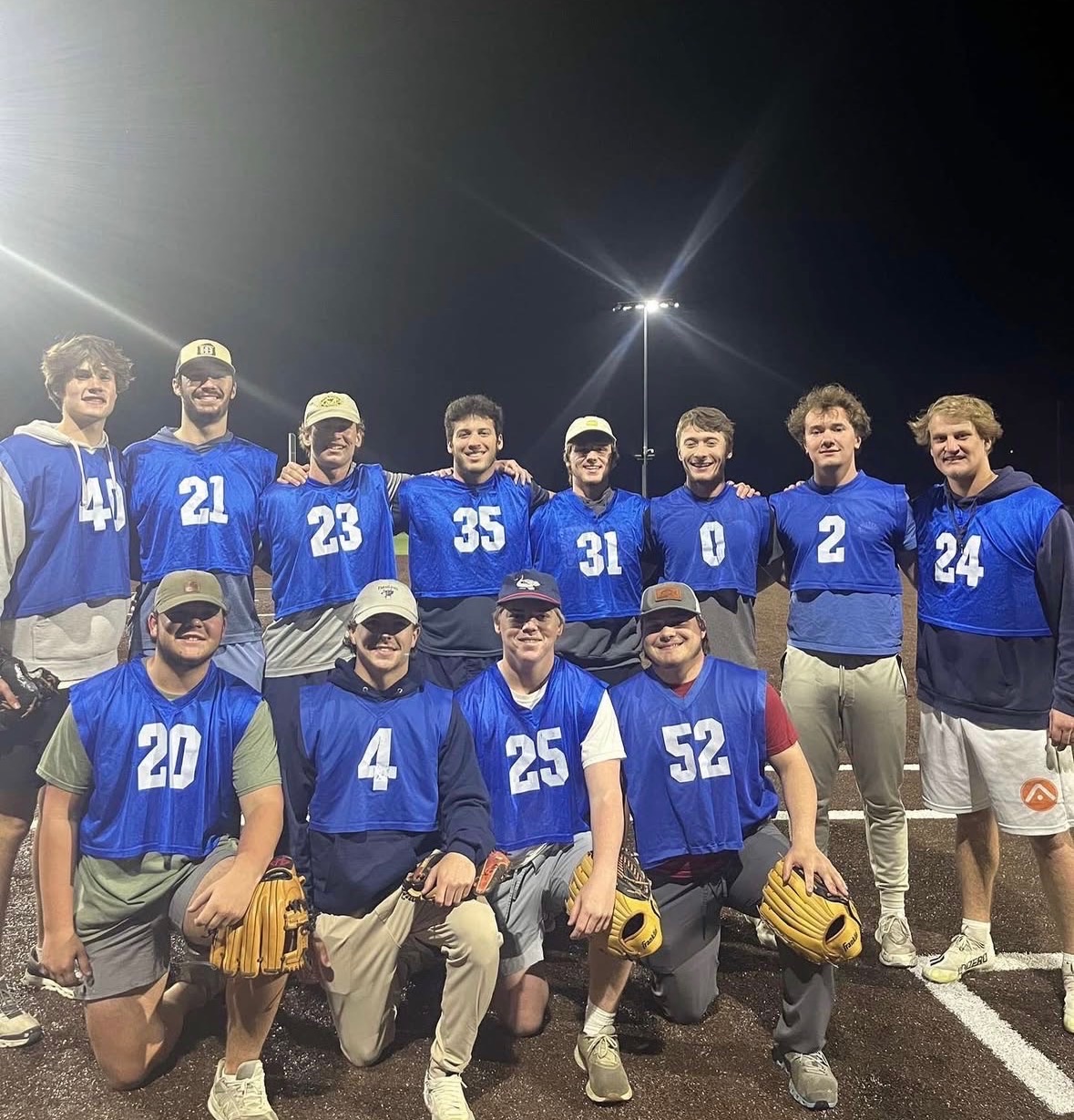 Romo Cup team photo at night in blue jerseys